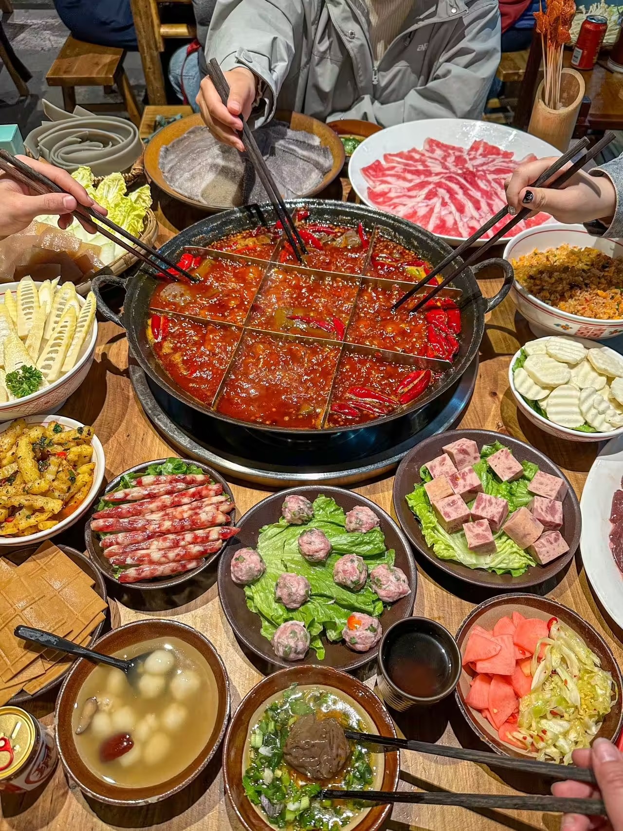 A Chongqing hotpot feast with a bubbling chilli broth and many side dishes